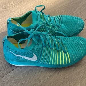 Nike Teal Athletic Flyknit Sneakers with Neon Yellow Accents